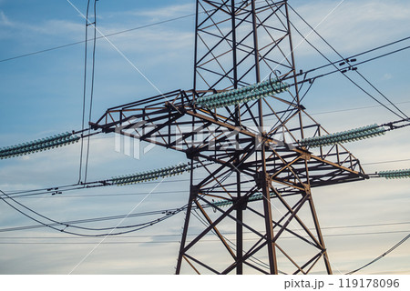 Electrical Equipment, High Voltage Power Line Insulators On Blue Sky Backdrop Electrical Equipment, High Voltage Power Line Insulators On Blue Sky Backdrop 119178096