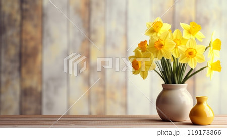 Bouquet of daffodils in vase on table, space for text. Fresh spring flowers 119178866