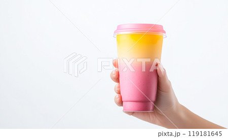 Colorful Layered Drink in a Handheld Cup Colorful Layered Drink in a Handheld Cup 119181645