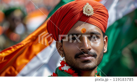 Young Man Celebrating India Independence Day with Traditional Attire and National Flag in the Background Young Man Celebrating India Independence Day with Traditional Attire and National Flag in the Background 119183785