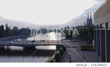 Drone point of view of Wroclaw with Peace bridge (cars and people) and  Cathedral of St.John the Baptist (two towers) and Oder 119184623