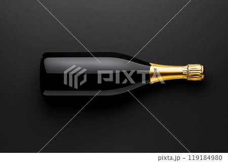 Champagne bottle with golden foil on dark background. Concept of celebration and sophistication 119184980