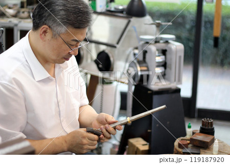 Gyeongsangnam-do, Jinju-si, Republic of Korea, October 11, 2024: Mr. Kim Myeong-su, the CEO of Jeonggeumgil Metalworking, is a person who lends gold to film companies. Gyeongsangnam-do, Jinju-si, Republic of Korea, October 11, 2024: Mr. Kim Myeong-su, the CEO of Jeonggeumgil Metalworking, is a person who lends gold to film companies. 119187920
