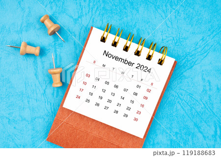November 2024 mini calendar with wooden thumbtack. 119188683