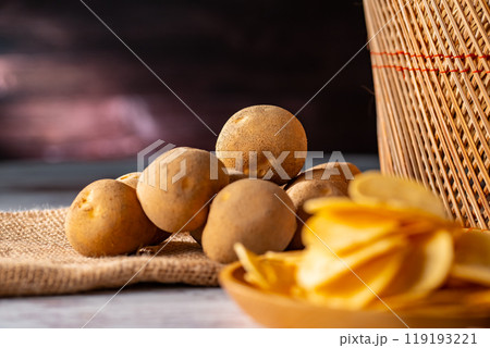 Potato chips on a wooden table. Potato chips on a wooden table. 119193221
