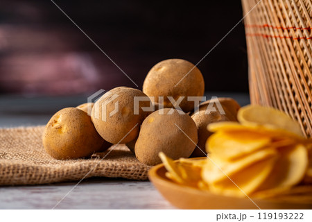 Potato chips on a wooden table. Potato chips on a wooden table. 119193222