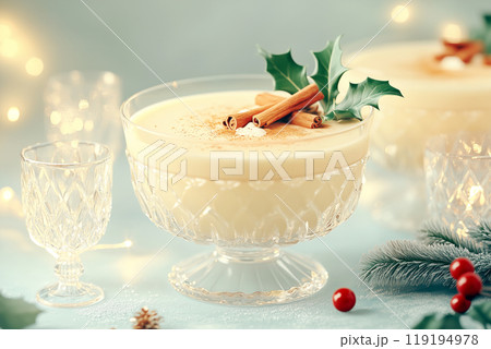 A close-up of eggnog garnished with cinnamon and holly, set on a soft background, evoking a festive Christmas atmosphere A close-up of eggnog garnished with cinnamon and holly, set on a soft background, evoking a festive Christmas atmosphere 119194978