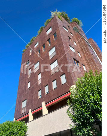 residential building in Monza with landscaping on roof in background blue sky 119194994
