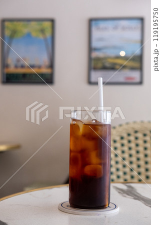 A glass of iced americano on the table A glass of iced americano on the table 119195750