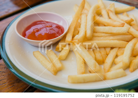 french fries on plate with tomato sauce french fries on plate with tomato sauce 119195752