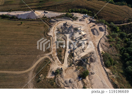 Aerial view of industrial crushed stone production, jaw crusher plant in stone quarry Aerial view of industrial crushed stone production, jaw crusher plant in stone quarry 119196689