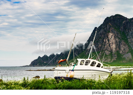 Seascape with old fishing boat on shore Seascape with old fishing boat on shore 119197318