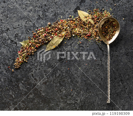 Mix of organic dried spices on a black stone background. Mix of organic dried spices on a black stone background. 119198309
