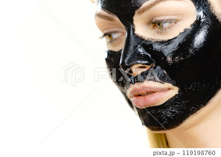 Girl black carbo peel off mask on face 119198760
