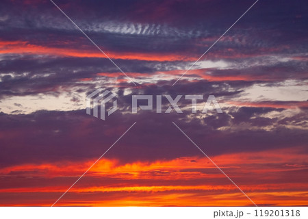 A beautiful sunset with a purple sky and clouds A beautiful sunset with a purple sky and clouds 119201318