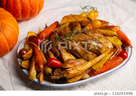 Baked chicken fillet with vegetables including sweet potatoes and pumpkin. Concept of saving resources, alternative to turkey on thanksgiving day 119201499