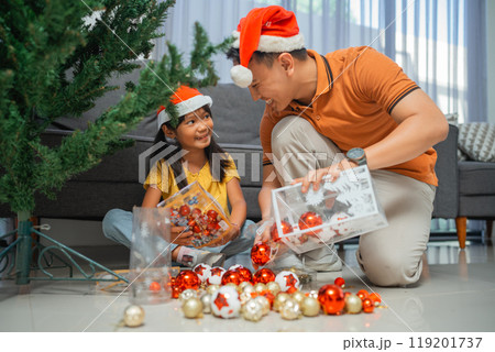 asian father and daughter preparing christmas day asian father and daughter preparing christmas day 119201737