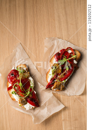 Sandwiches with cheese , mushrooms and grilled pepper on a wooden table Sandwiches with cheese , mushrooms and grilled pepper on a wooden table 119202512