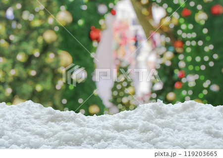 Empty white snow with blur Christmas tree with bokeh light background 119203665