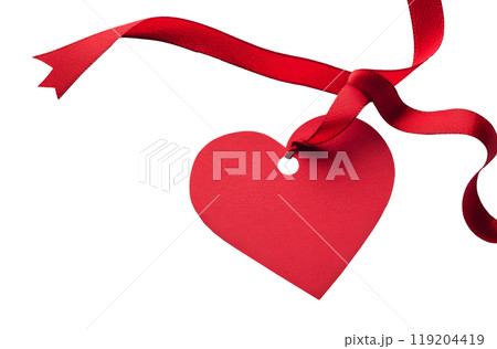 Red heart-shaped tag with a ribbon on a white background for Valentines Day or love occasions 119204419