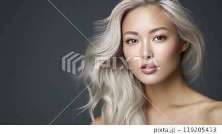 Portrait of a beautiful, sexy, smiling, happy blonde Asian woman with perfect skin, gray background, banner. 119205413