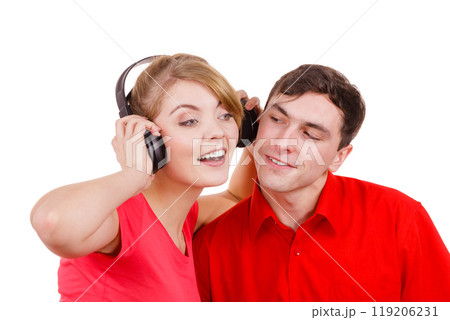 Couple two friends with headphones listening to music 119206231