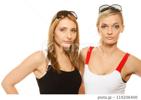 two women in summer clothes sunglasses portrait two women in summer clothes sunglasses portrait 119206400