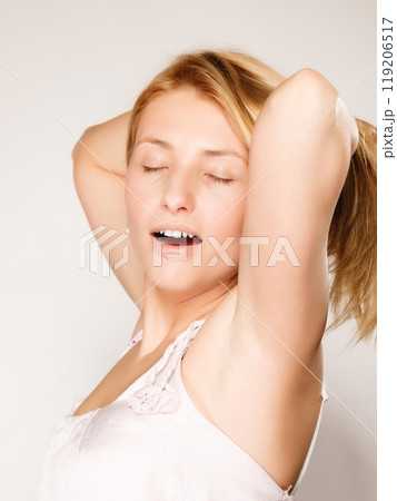 woman no makeup yawning and stretching woman no makeup yawning and stretching 119206517