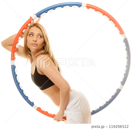 sporty fit girl doing exercise with hula hoop. sporty fit girl doing exercise with hula hoop. 119206522