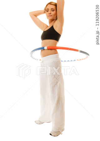 sporty fit girl doing exercise with hula hoop. sporty fit girl doing exercise with hula hoop. 119206530