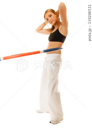 sporty fit girl doing exercise with hula hoop. 119206531