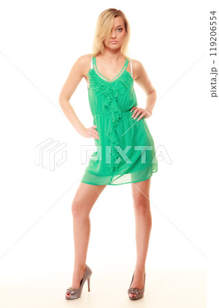 Summer fashion. Pretty fashionable girl in green dress 119206554