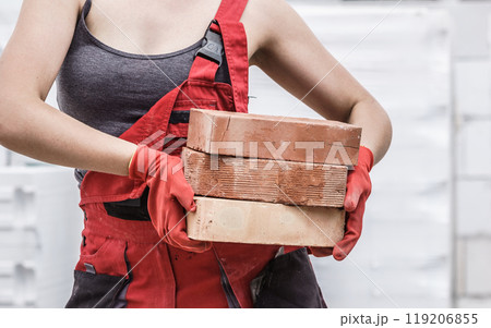 Woman working with bricks 119206855