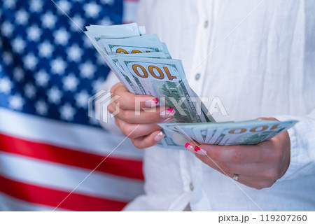 Counting Money Dollars Usd On Waving American National Flag Background. Finance 119207260