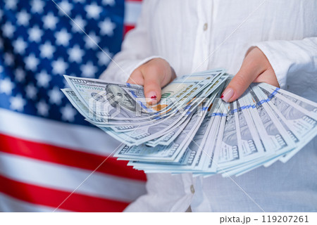 Counting Money Dollars Usd On Waving American National Flag Background. Finance 119207261