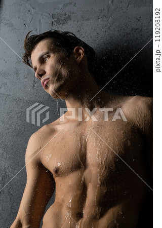 Shirtless muscular man in shower view 119208192
