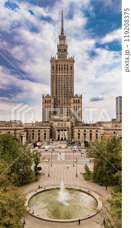 A stunning aerial view of the Palace of Culture and Science in Warsaw, Poland. This iconic skyscraper dominates the city skyline and is surrounded by beautiful parks and squares. 119208375