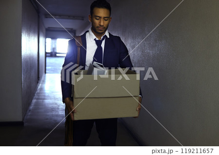 Businessman, fired and sad or depression with box in corridor with unemployment, dismissal and fail. Professional, employee and helpless in work building with bag, leaving and disappointed or stress 119211657