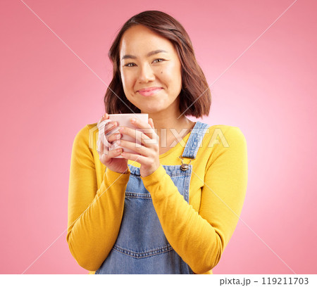 Woman, coffee and smile in studio portrait with hand holding hot drink for energy by pink background. Japanese student, gen z girl and happy for matcha, espresso or latte with fashion, relax and cup Woman, coffee and smile in studio portrait with hand holding hot drink for energy by pink background. Japanese student, gen z girl and happy for matcha, espresso or latte with fashion, relax and cup 119211703
