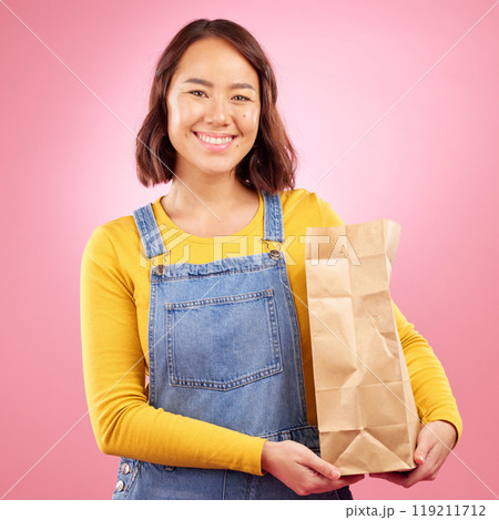 Woman, paper bag and studio portrait for grocery shopping, discount or choice with smile by pink background. Japanese gen z girl, retail customer and package for product, sale or happy for cheap deal Woman, paper bag and studio portrait for grocery shopping, discount or choice with smile by pink background. Japanese gen z girl, retail customer and package for product, sale or happy for cheap deal 119211712