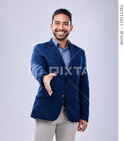 Smile, handshake and portrait of businessman in a studio for deal, partnership or onboarding. Happy, professional and Indian male lawyer with a shaking hands gesture for greeting by white background. 119212261