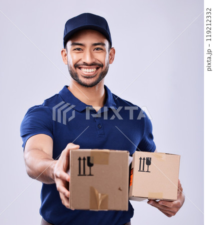 Smile, portrait and delivery man giving boxes in studio, safe transport for ecommerce supplier product. Package, logistics and happy courier person on white background for online sales and services. Smile, portrait and delivery man giving boxes in studio, safe transport for ecommerce supplier product. Package, logistics and happy courier person on white background for online sales and services. 119212332