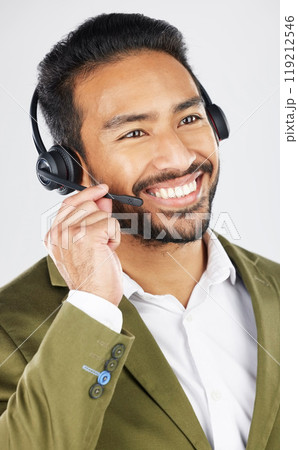 Happy asian man, call center and headphones in customer service, support or telemarketing against a white studio background. Friendly businessman, consultant or agent smile in online advice or help 119212546