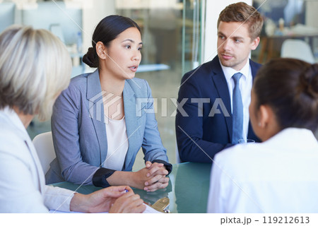 Business meeting, conversation and corporate consulting with discussion for project and teamwork. Staff, working and company with planning and professional talk at a desk in a consultant office 119212613