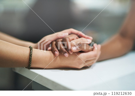 Sad, support and people holding hands, counseling and therapy for grief, trauma and compassion with loss. Prayer, friends and closeup with crisis, sympathy and empathy with respect and community 119212630