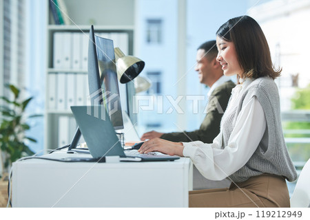 Business, planning and asian woman on laptop and computer in office for research or strategy in coworking space. Online, search and happy female designer smile for creative, networking or design 119212949