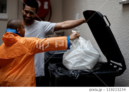 Father, son and trash or home garbage in plastic bag outdoor with smile, support or bonding with help. Happy family, man and boy child with morning routine, waste or rubbish for recycling or cleaning Father, son and trash or home garbage in plastic bag outdoor with smile, support or bonding with help. Happy family, man and boy child with morning routine, waste or rubbish for recycling or cleaning 119213234