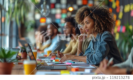 A diverse group of colleagues working on a group project. A diverse group of colleagues working on a group project. 119213278