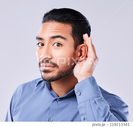 Hands, ear and portrait of asian man in studio for gossip, listening or speak up sign on grey background. Hearing, secret and face of Japanese guy model with emoji icon for deaf, sign language or huh Hands, ear and portrait of asian man in studio for gossip, listening or speak up sign on grey background. Hearing, secret and face of Japanese guy model with emoji icon for deaf, sign language or huh 119213381