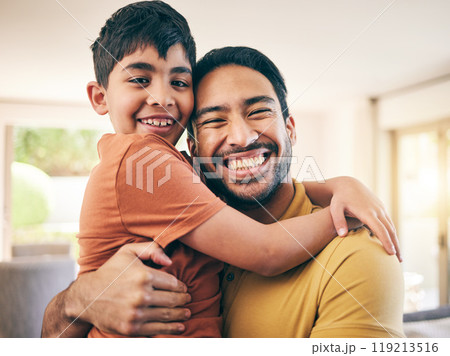 Happy, portrait and father hugging his child in the living room of a modern house for bonding. Smile, love and excited young dad embracing his boy kid from Colombia in the lounge of a family home. Happy, portrait and father hugging his child in the living room of a modern house for bonding. Smile, love and excited young dad embracing his boy kid from Colombia in the lounge of a family home. 119213516